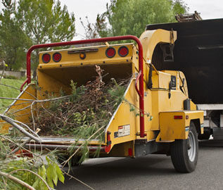 disaster cleanup wood chipper at work